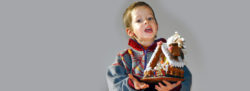 Weihnachtskarte 06: der Junge mit dem Lebkuchenhaus
